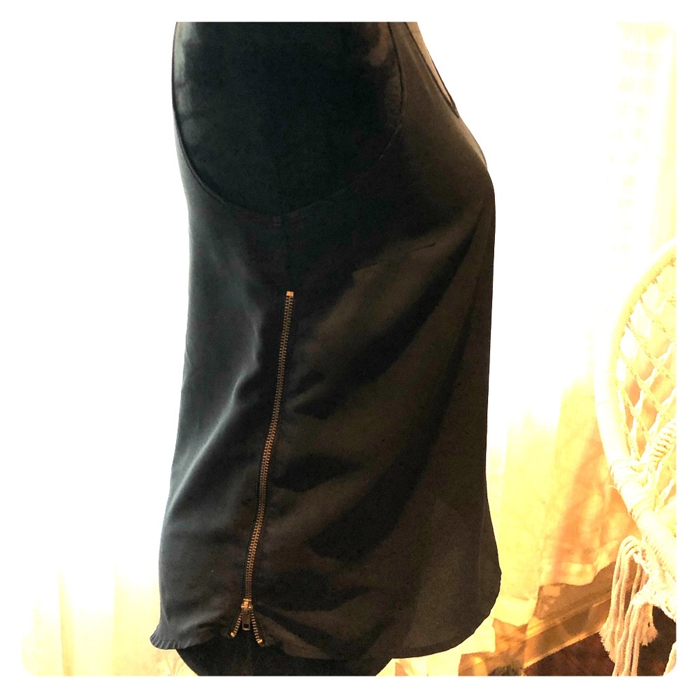 Black sleeveless top with bronze side zippers